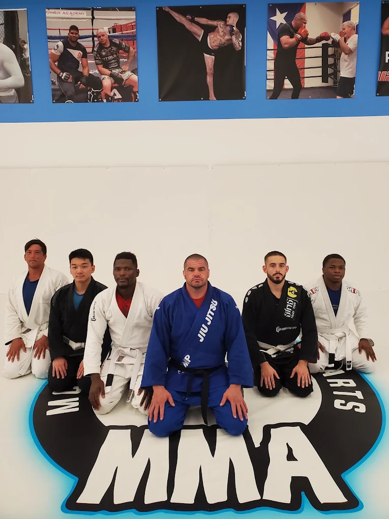 Brazilian Jiu-Jitsu group in gis with Coach James