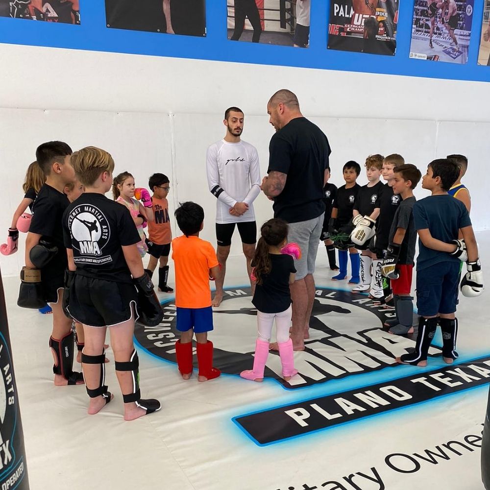 James McSweeney coaching a kids martial arts class