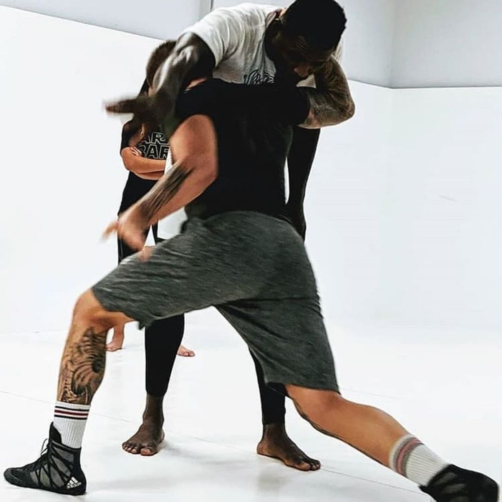 Grappling and takedown drills on the mats